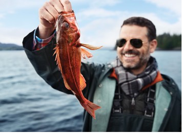 Guest holding a rockfish caught on a Princess excursion